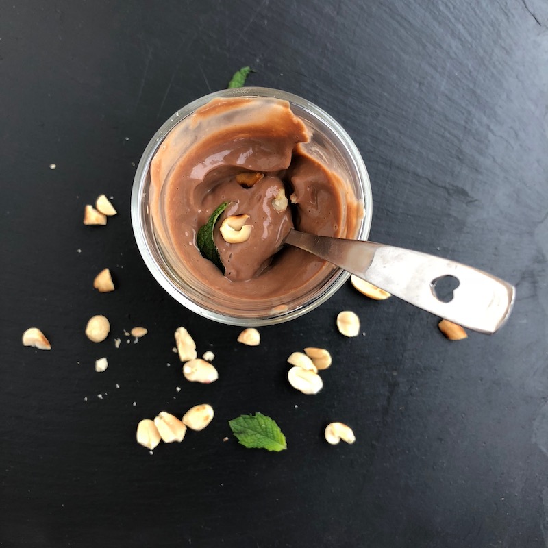 Chocolate Peanut Butter Mousse, vegan, plantbased, almost eaten, with spoon in glass