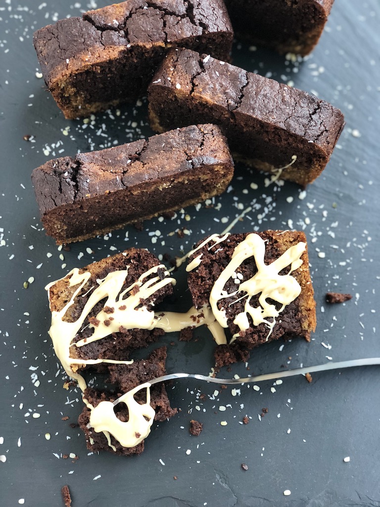 Coco-Choco-Marble Cake with Cashew butter drizzle, vegan, plantbased, on black background