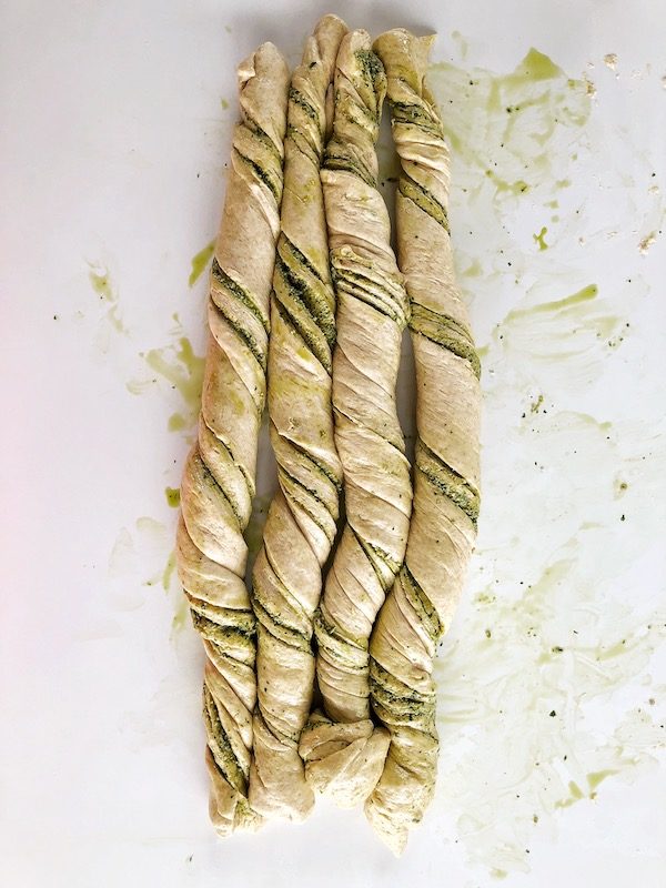 Raw twisted pesto bread dough