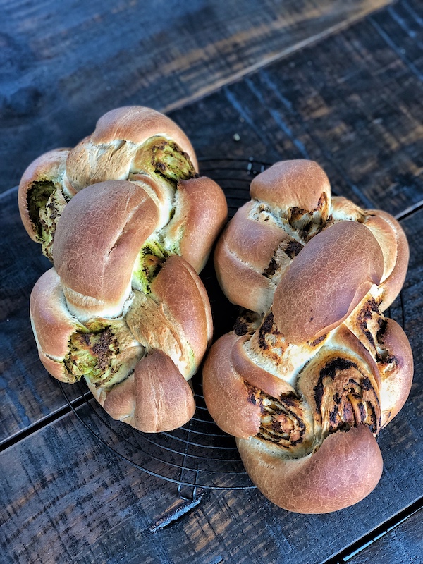 Braided Bread with Turmeric Cashew Pesto Filling on brown wooden background